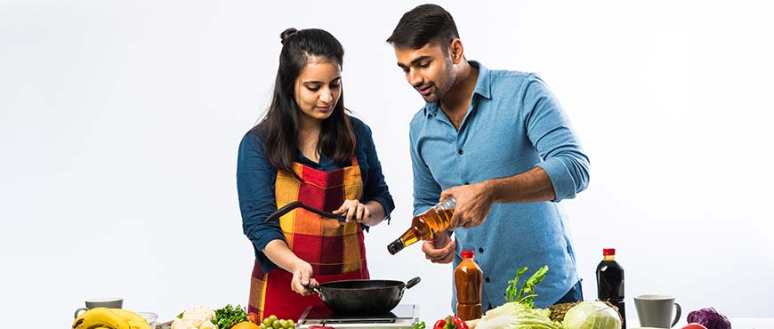Couple cooking Indian food