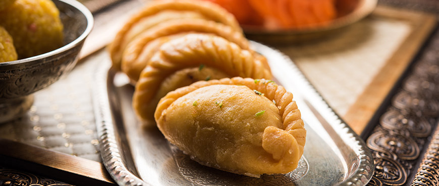 Khoya Gujiya in a silver plate